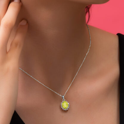 18k White Gold Necklace adorned with a stunning natural peridot centrepiece, surrounded by natural diamonds. Part of the prestigious Diana Collection, this necklace draws inspiration from the iconic royal jewellery worn by Princess Diana. The delicate rose gold complements the soft blush of the Rose Quartz, while the diamonds add a touch of brilliance, creating an elegant piece that evokes timeless beauty and sophistication.