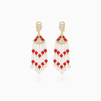 Step into elegance with our captivating 18K Yellow Gold Dangling Earrings, designed to enhance your natural beauty with their brilliant Sparkling natural diamonds vibrant coral stones and vibrant colours.