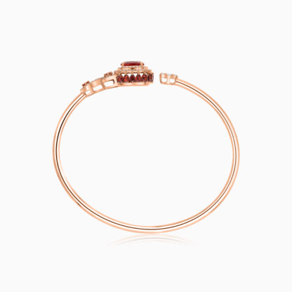 18k Rose Gold Bangle featuring a stunning Garnet Gemstone, beautifully complemented by natural diamonds