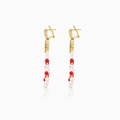 Step into elegance with our captivating 18K Yellow Gold Dangling Earrings, designed to enhance your natural beauty with their brilliant Sparkling natural diamonds vibrant coral stones and vibrant colours.