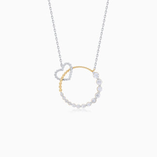 18k yellow and white gold NECKLACE in the shape of an intertwined circle with a small heart studded with natural diamonds