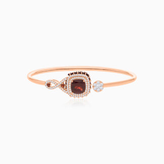 18k Rose Gold Bangle featuring a stunning Garnet Gemstone, beautifully complemented by natural diamonds