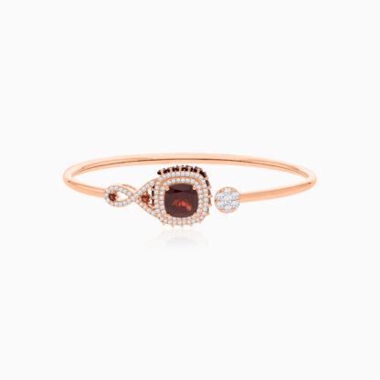 18k Rose Gold Bangle featuring a stunning Garnet Gemstone, beautifully complemented by natural diamonds